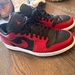 Nike Air Jordan 1 Low sneakers in the 'Reverse Bred' colorway.